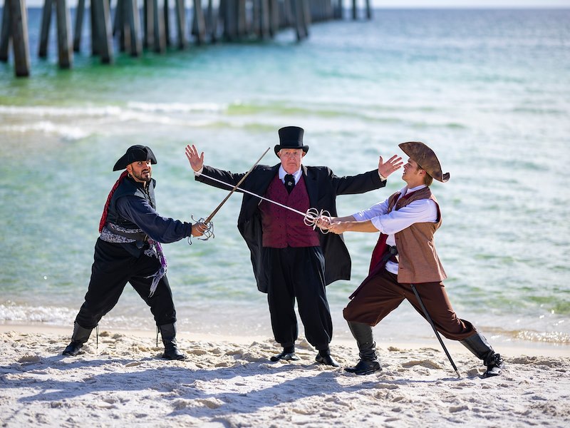 pirates sword-fighting on the beach